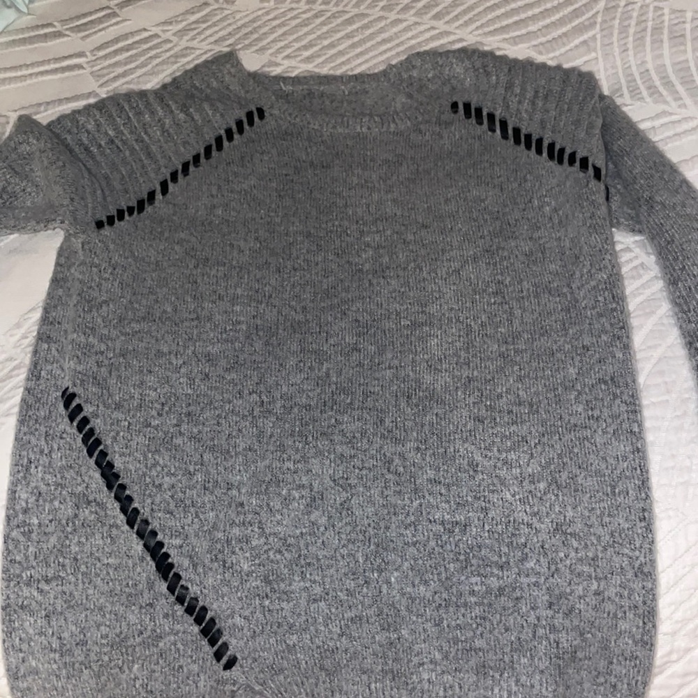 Gray sweater with bits of leather